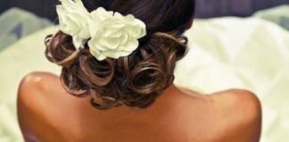20 Gorgeous Black Wedding Hairstyles Low Updo with Flower Black Wedding Hairstyles
