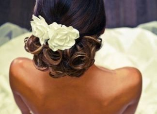 20 Gorgeous Black Wedding Hairstyles Low Updo with Flower Black Wedding Hairstyles