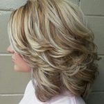 Back-Swept Layers Medium Curly Hairstyles