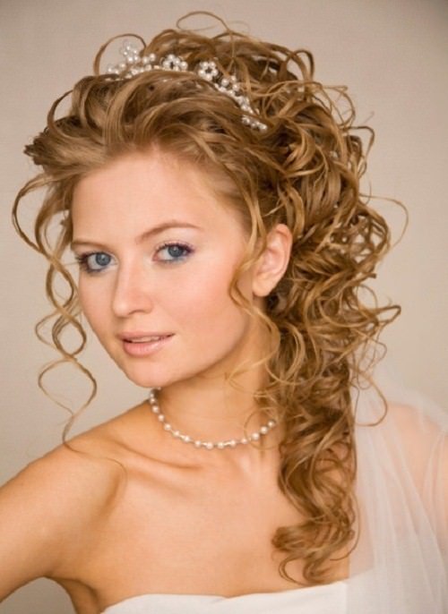 Mesmerizing Curls with a Tiara beach wedding hairstyles