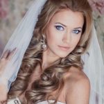 Hairstyle for a Fluffy Veil beach wedding hairstyles
