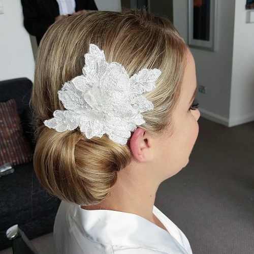 Side Bun with Floral Hair Accessory Side Bun Hairstyles