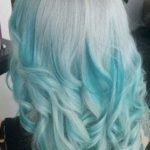 Sky Blue Curls with White Highlights- Pastel blue hairstyles