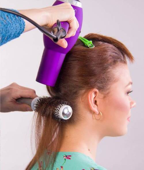 Style your Hair with a Round Brush and Blow-Dryer- lovely downdo with a face framing lace braid