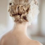 Textured Bun with a Flower- Wedding curly hairstyles